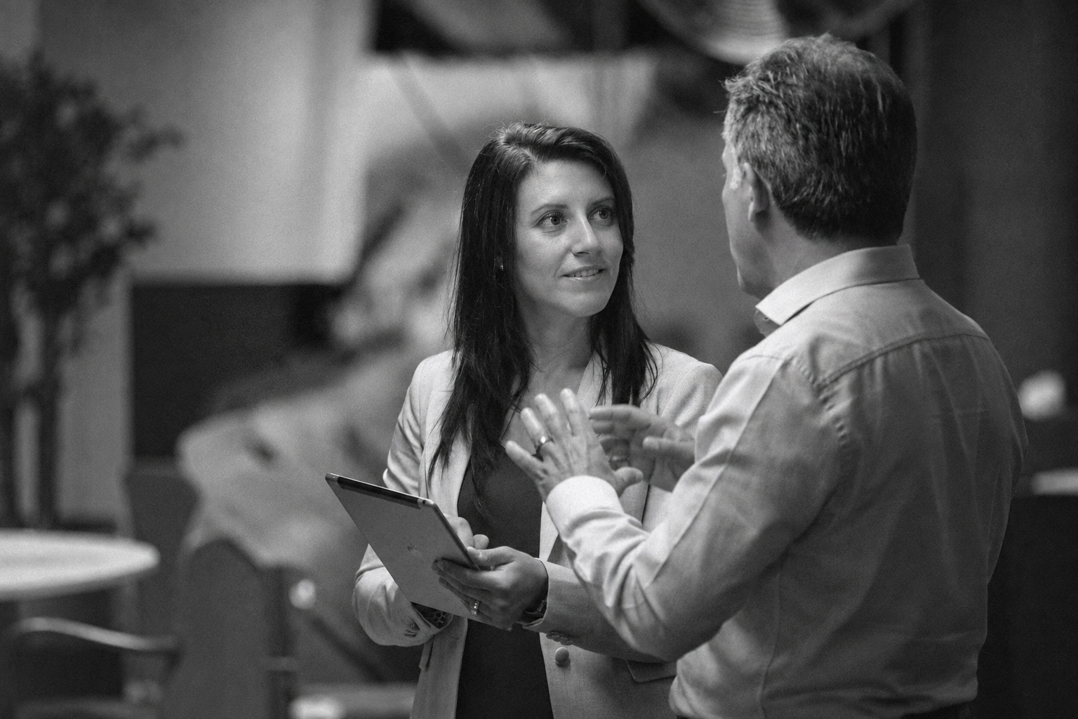 Vendor colleagues discussing operational decisions with a tablet